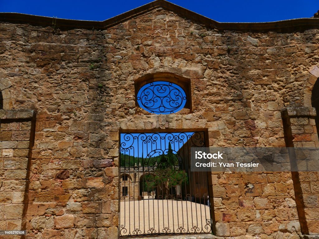 Gate of the main courtyard of the Abbaye de Fontfroide, Aude Abbey - Monastery Stock Photo