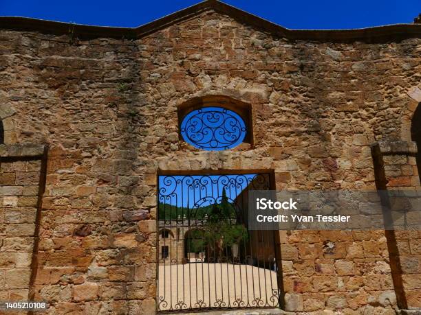 Gate Of The Main Courtyard Of The Abbaye De Fontfroide Aude Stock Photo - Download Image Now