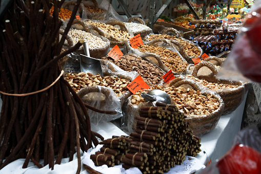 A stall selling a variety of nuts and dried fruit at the Alicante fogueras festivities flea market.