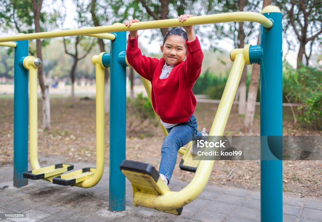 Little Girl Playing Fitness Equipment 6-7 Years Stock Photo