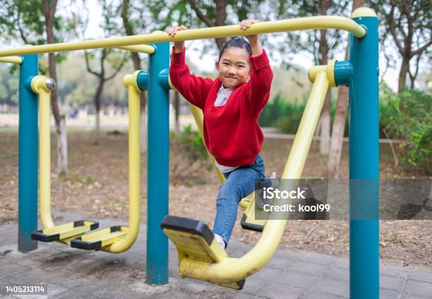 Little Girl Playing Fitness Equipment Stock Photo - Download Image Now - 6-7 Years, Active Lifestyle, Cheerful