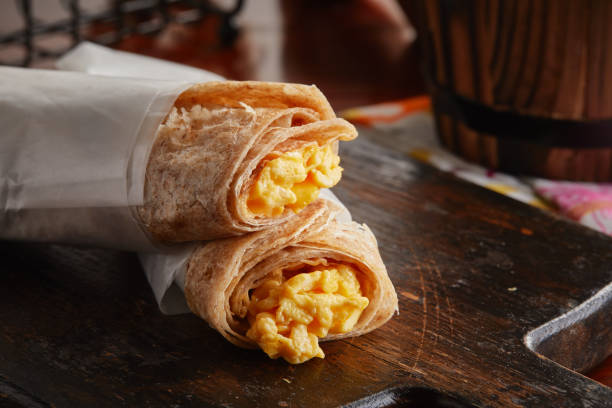 istock Egg Cheese Chapati Scrambled roll served in a dish isolated on wooden background side view 1405213375