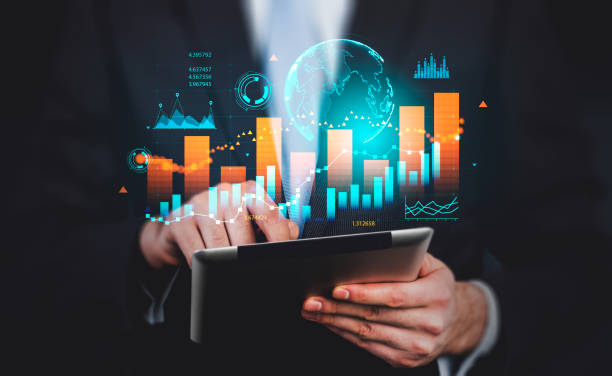Businessman using tablet, earth sphere and stock market and lines dynamics