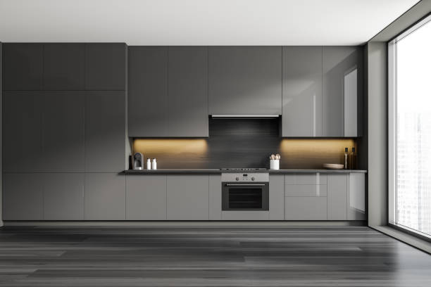 istock Grey kitchen interior with shelves and appliances, panoramic window 1405214657