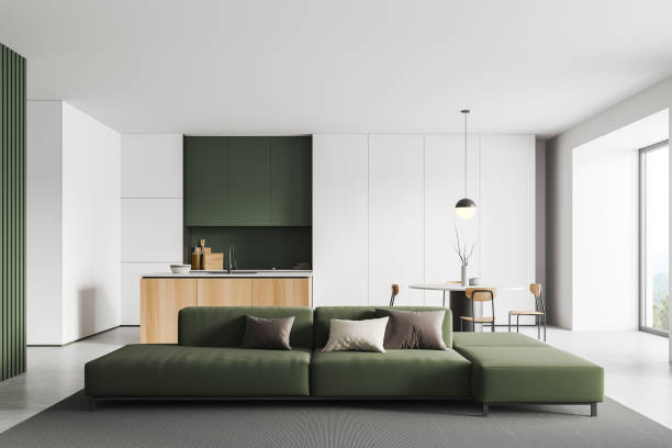 istock Kitchen interior with couch and eating table with countertop, panoramic window 1405215993
