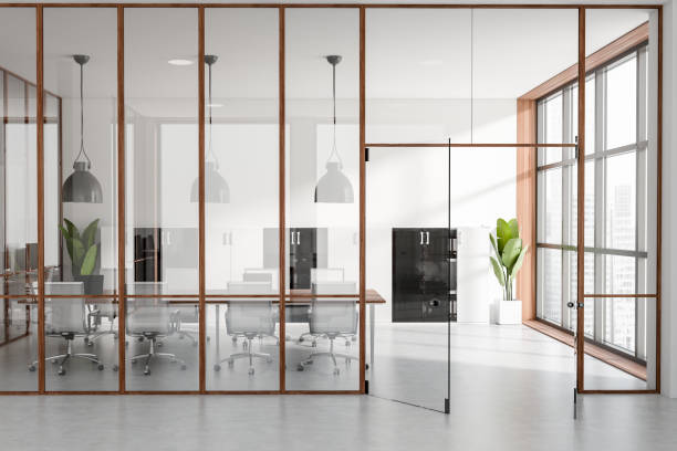 istock Light meeting room interior with seats behind glass doors, panoramic window 1405217748
