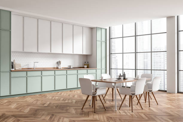 istock Kitchen interior with eating table and seats, shelves and kitchenware, window 1405217928