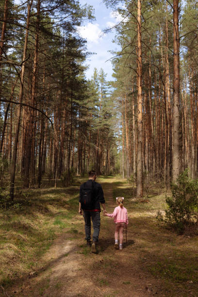 istock Young dad and daughter walk 1405219857