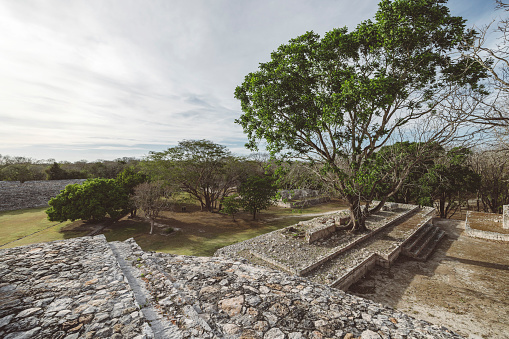 Old mayan city ruins with green grass in Mexico
