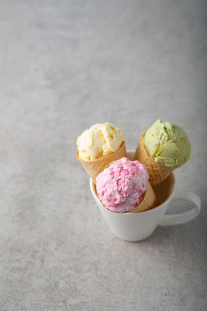 istock Ice cream scoops in wafer cones gelato copy space 1405222978