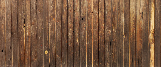 Wooden background is a very high resolution Panorama. Vertical boards without gaps. Brown