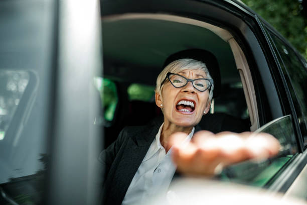 istock Senior woman driving car 1405227328
