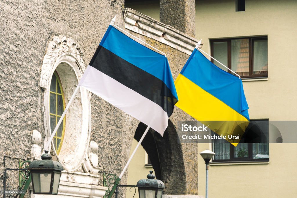 Flag of Estonia and Ukraine waving together Flag of Estonia and Ukraine waving together on the wall of a building Estonia Stock Photo