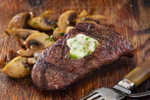 Medium Rare Top Sirloin Steak with Garlic Herb Butter and Mushrooms