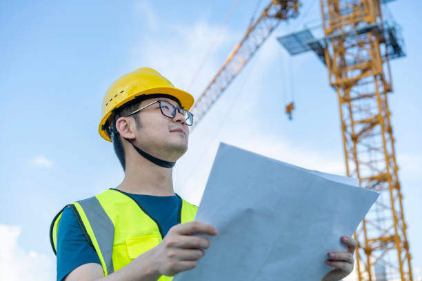 istock Asian general contractor working at the construction site 1405229379