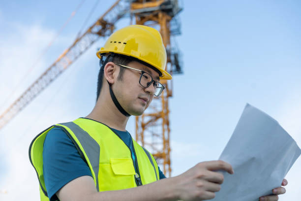 istock Asian general contractor working at the construction site 1405229939