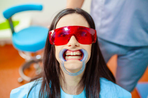 istock Woman preparing for laser teeth whitening 1405230029
