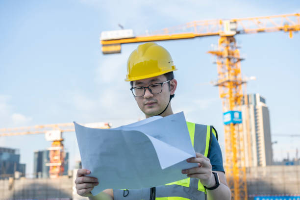 istock Asian general contractor working at the construction site 1405230317