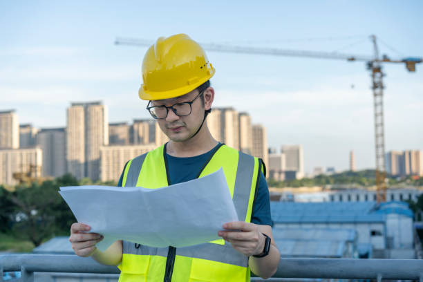 istock Asian general contractor working at the construction site 1405230338