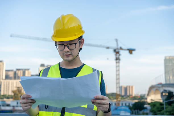 istock Asian general contractor working at the construction site 1405230339