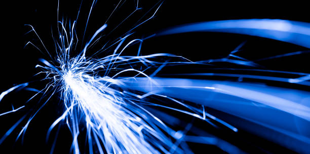 istock blue sparks in the dark. lines of light. 1405231768