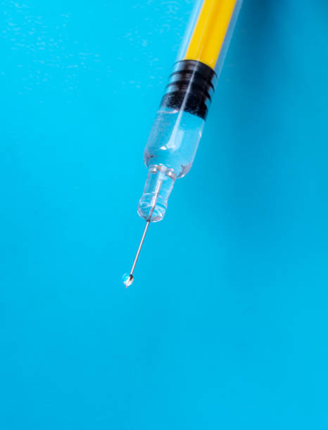istock medical syringe, needle with drop 1405231805