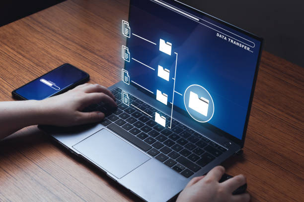 istock Woman using laptop to manage document system storage concept. 1405232334