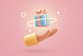 istock 3d vector cartoon human hand giving magic gift box with light effect vector illustration. Arm holding blue giftbox design element on soft pink background 1405233091