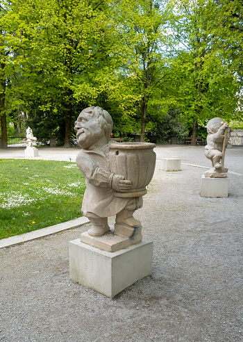 Dwarf Garden (Zwergerlgarten) - position 4 Dwarf with vase - 17th century statue - Salzburg, Austria.