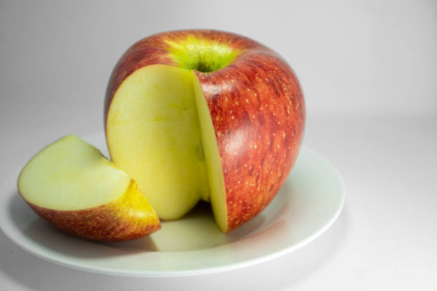 istock Fresh apple. Closeup studio shot isolated on a white dish. 1405233481