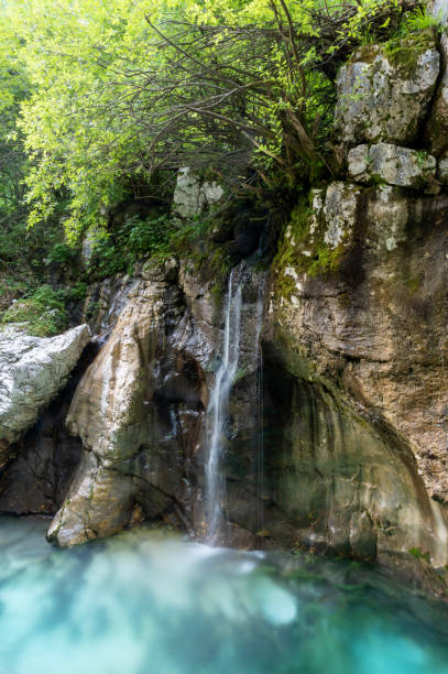 istock Water dripping down the rocks into the soca river 1405235149