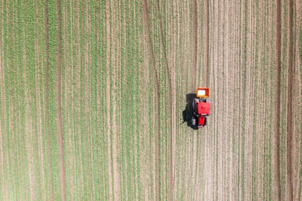 istock Tractor working on agricultural field 1405236010