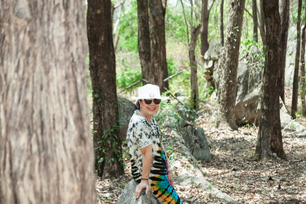 istock Old lady in the forest 1405238471