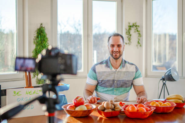istock Young doctor making a video about importance of implementing fruit in everyday diet 1405239225