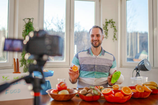 istock Young doctor making a video about importance of implementing fruit in everyday diet 1405239339