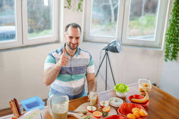 istock Man making fresh smoothie at home 1405239340