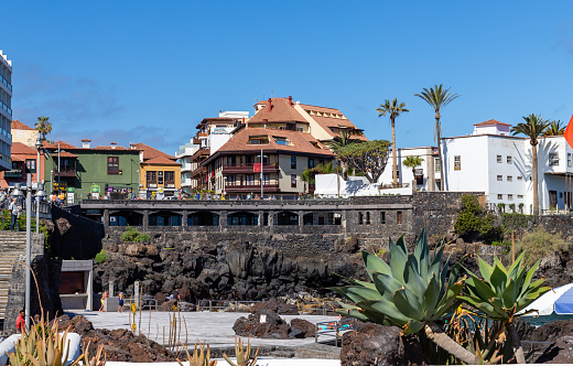 Puerto de la Cruz, Tenerife, Spain - Apr 9, 2022, Promenade in Puerto de la Cruz with tropical Canarian vegetation, Tenerife, Canary Islands
