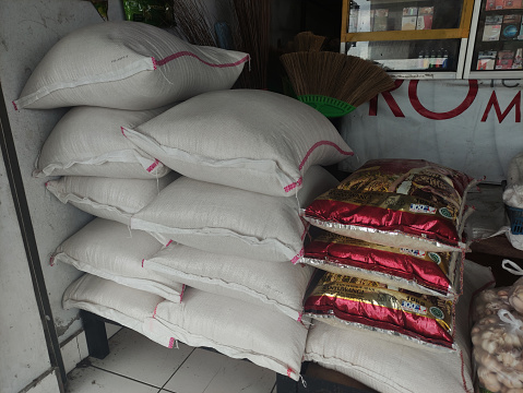 Bali, Indonesia - December 22, 2021: pile of rice sacks in the grocery store