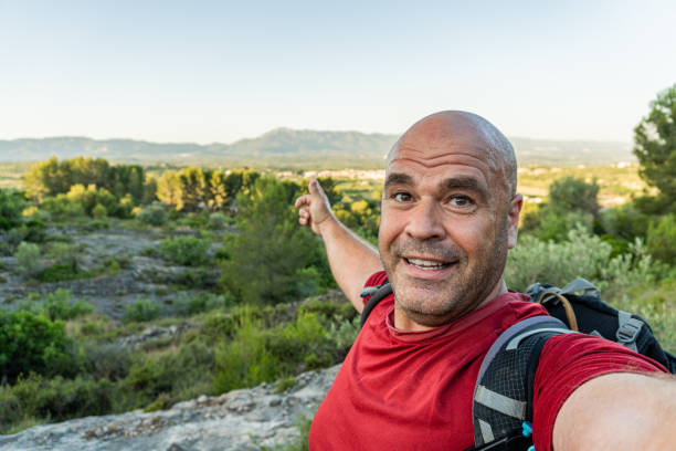 istock sweat man hiker landscape taking selfie 1405240749