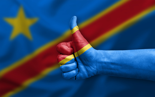 Hand making thumb up painted with flag of dr congo