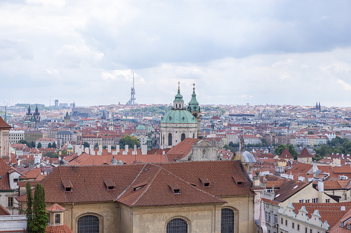 05/30/2022, Prague city, Czech republic. View of Prague old town from a gothic tower. Overcast sky, Springtime.\nNo people.