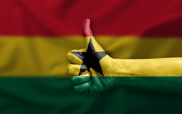 Hand making thumb up painted with flag of ghana
