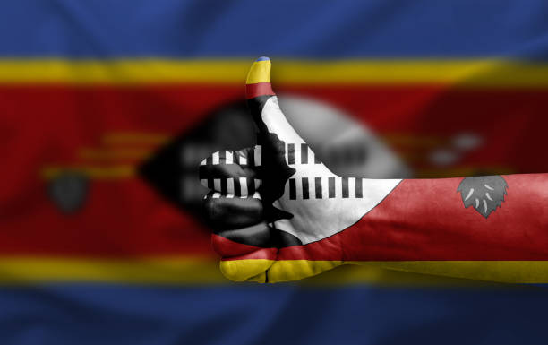 Hand making thumb up painted with flag of eswatini
