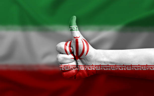 istock Hand making thumb up painted with flag of iran 1405243560