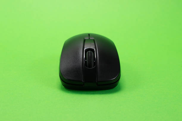 istock Wireless black mouse on a green isolated chroma key background 1405248200