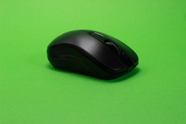 istock Wireless black mouse on a green isolated chroma key background 1405248285