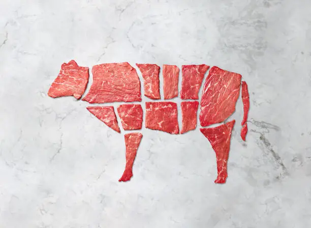 Creative concept marbled meat beef on white marbled background. Top view.