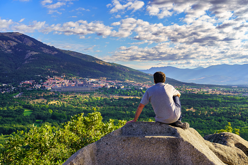 Man contemplating the views of El Escorial between the mountains, Madrid