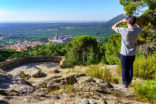 Man contemplating the breathtaking views of the monastery of El Escorial, Madrid