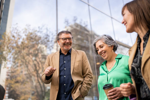 istock Coworkers walking and talking outdoors 1405260689